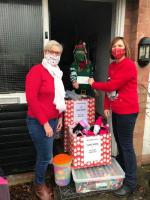 Six Town Rotary Club members, Bev Clayton and Sharon Egerton, presented the teddies to Sylvia Keris, 